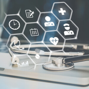 Stethoscope on laptop. Health care icons on virtual screen. Healthcare, medical technology concept